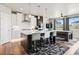 Bright eat-in kitchen featuring a large island with bar seating and modern appliances at 23814 E 36Th Pl, Aurora, CO 80019
