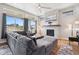 Inviting living room with fireplace, large windows, and comfortable furniture at 23814 E 36Th Pl, Aurora, CO 80019