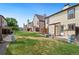 View of backyard and other townhomes with shared green space in the community at 14485 E Hawaii Cir # B, Aurora, CO 80012