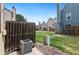 A view of the backyard with green grass, fencing and other townhomes nearby at 14485 E Hawaii Cir # B, Aurora, CO 80012