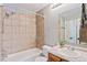 Cozy bathroom features a shower-tub combination and a granite countertop vanity at 14485 E Hawaii Cir # B, Aurora, CO 80012