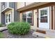 Close-up of a townhome entrance with a well-kept yard at 14485 E Hawaii Cir # B, Aurora, CO 80012