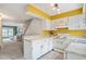 Bright kitchen featuring white cabinets and modern appliances at 14485 E Hawaii Cir # B, Aurora, CO 80012