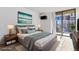 This staged bedroom is complete with contemporary decor and a private balcony at 1020 15Th St # 15K, Denver, CO 80202