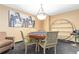 Cozy card room with a custom table, unique seating, and stylish decor at 1020 15Th St # 15K, Denver, CO 80202