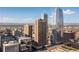 Stunning exterior showcasing high-rise building with city skyline and mountain view at 1020 15Th St # 15K, Denver, CO 80202
