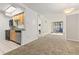 Open kitchen with wood cabinets, stainless steel appliances, and tile flooring at 1020 15Th St # 15K, Denver, CO 80202