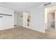 Bright living room featuring neutral carpet and access to the bathroom and kitchen at 1020 15Th St # 15K, Denver, CO 80202