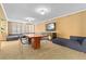 Inviting lounge area with comfortable seating, wooden table, and modern entertainment at 1020 15Th St # 15K, Denver, CO 80202