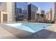 Outdoor rooftop pool with a city view, surrounded by high-rise buildings at 1020 15Th St # 15K, Denver, CO 80202