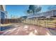 Backyard shot showing a patio, wood retaining wall, and partial fencing at 5421 E Prescott Ave, Castle Rock, CO 80104