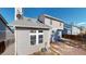 Back of home with backyard featuring a patio and a gray shingled roof with skylights at 5421 E Prescott Ave, Castle Rock, CO 80104