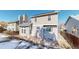 Two-story home's backyard with a patio, stone landscaping, and privacy fence at 5421 E Prescott Ave, Castle Rock, CO 80104