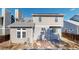 Backyard view of the home featuring a small patio and large windows, and a few bushes at 5421 E Prescott Ave, Castle Rock, CO 80104