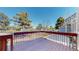 Spacious deck featuring stained wood railings and ample space for relaxing and entertaining outdoors at 5421 E Prescott Ave, Castle Rock, CO 80104