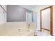 Bathroom with a large tub and a glass-enclosed shower at 5421 E Prescott Ave, Castle Rock, CO 80104