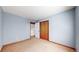 Bedroom with a window, standard closet, and light blue walls at 5421 E Prescott Ave, Castle Rock, CO 80104