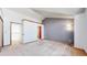 Bedroom with vaulted ceilings, neutral carpet, and a view to an adjacent room at 5421 E Prescott Ave, Castle Rock, CO 80104