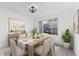 Cozy dining room featuring a wooden table set for a meal, complemented by a window and stylish decor at 5421 E Prescott Ave, Castle Rock, CO 80104