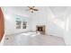 Spacious living room featuring a brick fireplace, high ceilings and large windows at 5421 E Prescott Ave, Castle Rock, CO 80104
