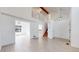 Open-concept living room with white walls, light flooring, and bright natural light at 5421 E Prescott Ave, Castle Rock, CO 80104
