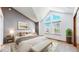Serene main bedroom with large windows, vaulted ceiling, neutral tones, and stylish furnishings at 5421 E Prescott Ave, Castle Rock, CO 80104