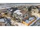 Aerial view of homes, showcasing their layout, roofs, and snowy yards at 28314 E 6Th Pl, Watkins, CO 80137