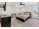 Bright bedroom with a floral comforter, dark furniture, and lots of natural light at 28314 E 6Th Pl, Watkins, CO 80137