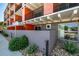 Street view of the modern building exterior with visible architectural details and a well-maintained landscape at 1495 Vrain St # 110, Denver, CO 80204