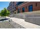 Modern brick building with large windows and a convenient bicycle rack, set along a well-maintained sidewalk at 1495 Vrain St # 110, Denver, CO 80204