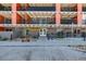 Modern building exterior with a clean and inviting entrance and a variety of colorful architectural elements at 1495 Vrain St # 110, Denver, CO 80204