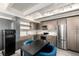 Contemporary kitchen features stainless steel appliances, light-colored cabinets, and an open layout at 1495 Vrain St # 110, Denver, CO 80204