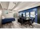 Inviting living space with a sleek desk, comfortable seating, and a cozy bed near the sliding glass door at 1495 Vrain St # 110, Denver, CO 80204