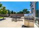 Outdoor patio area with a barbecue grill and dining set for outdoor entertaining at 1495 Vrain St # 110, Denver, CO 80204