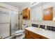 Functional bathroom with a shower, classic vanity, and ample lighting at 10654 W Dumbarton Cir # A, Littleton, CO 80127