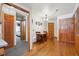 Charming dining area featuring hardwood floors, wooden table, and classic light fixtures at 10654 W Dumbarton Cir # A, Littleton, CO 80127