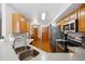 Functional kitchen with stainless steel appliances, ample cabinetry, and a seamless connection to the dining area at 10654 W Dumbarton Cir # A, Littleton, CO 80127