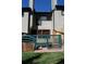 Backyard patio with wooden fence, grassy area, and stacked firewood, ideal for outdoor enjoyment at 223 S Fuller Placer Rd # 4, Breckenridge, CO 80424