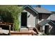 Exterior view of a multi-story home with wooden siding, steps, and a cozy entrance at 223 S Fuller Placer Rd # 4, Breckenridge, CO 80424