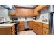 Well-lit kitchen featuring wooden cabinets, stainless steel appliances, and ample countertop space at 223 S Fuller Placer Rd # 4, Breckenridge, CO 80424