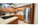 Well-lit kitchen featuring wooden cabinets, stainless steel appliances, and ample countertop space at 223 S Fuller Placer Rd # 4, Breckenridge, CO 80424