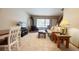 Comfortable living room with a sleeper sofa, wood-burning fireplace, window, and staircase access to other levels at 223 S Fuller Placer Rd # 4, Breckenridge, CO 80424