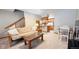 Cozy living room featuring a sleeper sofa, coffee table, dining table, and staircase access to other levels at 223 S Fuller Placer Rd # 4, Breckenridge, CO 80424