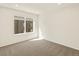 Bright bedroom featuring neutral carpeting and large window at 13861 Del Corso Way, Broomfield, CO 80020