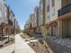 Townhome community with a walkway and landscaping at 13861 Del Corso Way, Broomfield, CO 80020