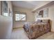 Comfortable bedroom showcasing a picture window and unique wall art adding style and character at 1295 Hy Vu Dr, Evergreen, CO 80439