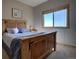 Bright bedroom with a large window offering lots of natural light and a spacious feel at 1295 Hy Vu Dr, Evergreen, CO 80439
