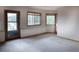 Large bonus room with multiple windows framing scenic views, perfect for a home office or recreation area at 1295 Hy Vu Dr, Evergreen, CO 80439