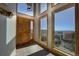 Bright entryway featuring tile floors, a wood door, and lots of windows offering amazing views at 1295 Hy Vu Dr, Evergreen, CO 80439