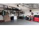 Well-organized garage with overhead storage, wall-mounted bike racks, and organized tools and equipment at 1295 Hy Vu Dr, Evergreen, CO 80439